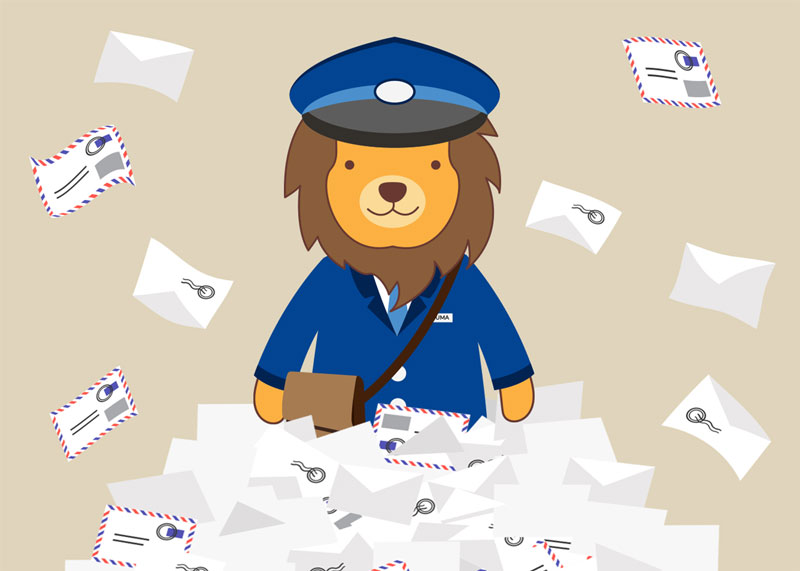 Ƶ mascot, Numa, dressed as a mail carrier standing in a pile of letters
